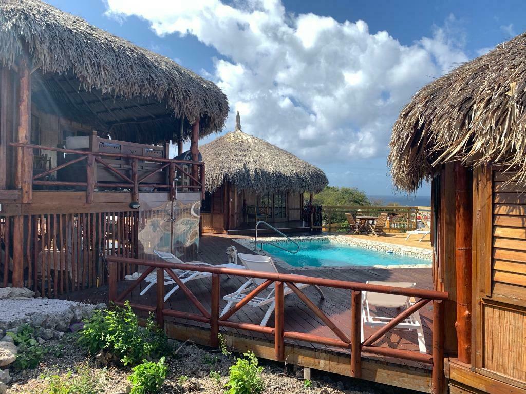 Romantische Palapa lodge Curacao aan zee met zwembad te huur, Vakantie, Vakantiehuizen | Nederlandse Antillen, 8 personen, 4 of meer slaapkamers