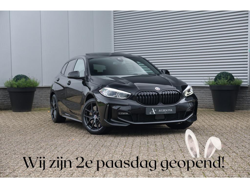 BMW 1-serie 118i M-Sport Aut. NAP|Pano|Stoelvw|Cam|Trekhaak|, 136 pk, Gebruikt, Lichtsensor, Zwart
