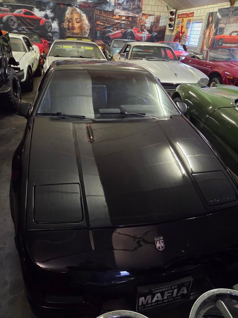 Pontiac Fiero 2.8 GT K6 1986 zwart. Km stand 123643., Auto's, 454 kg, Stof, 1280 kg, Overige modellen