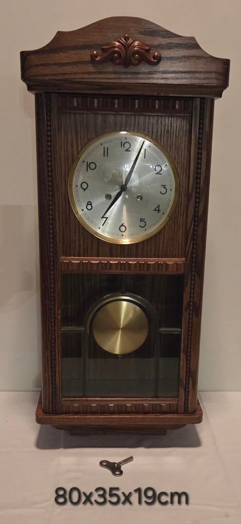 Regulateur wandklok in eikenhouten uitvoering, Ophalen