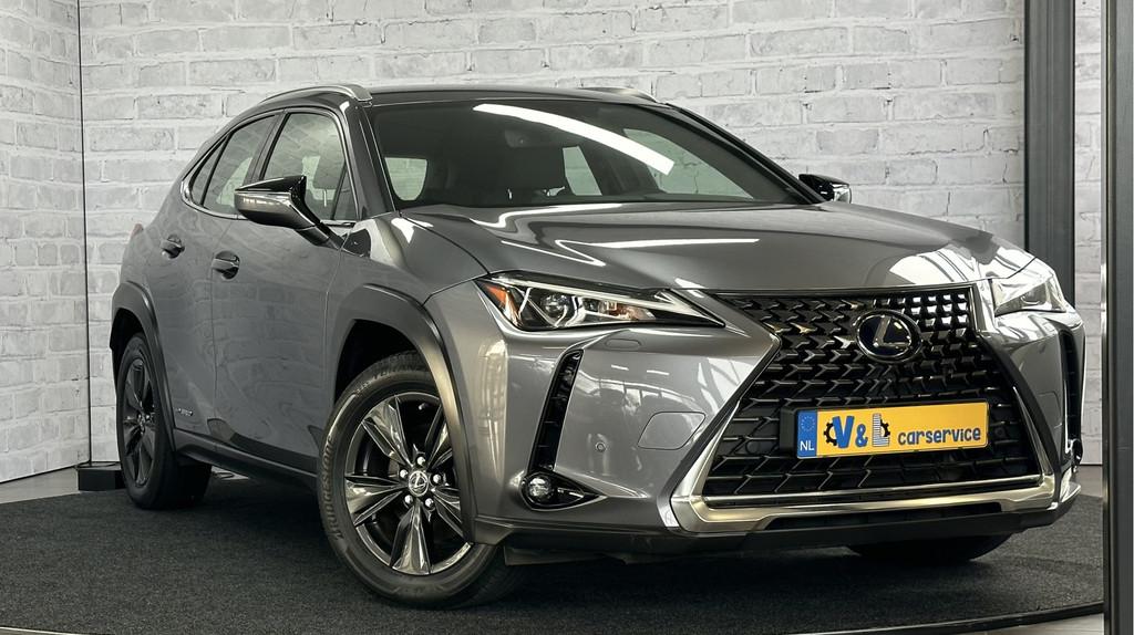 Lexus UX 250h First Edition / Stoel/stuurverwr / Carplay / A, Auto's, Lexus, Stof, Gebruikt, 4 cilinders, Grijs