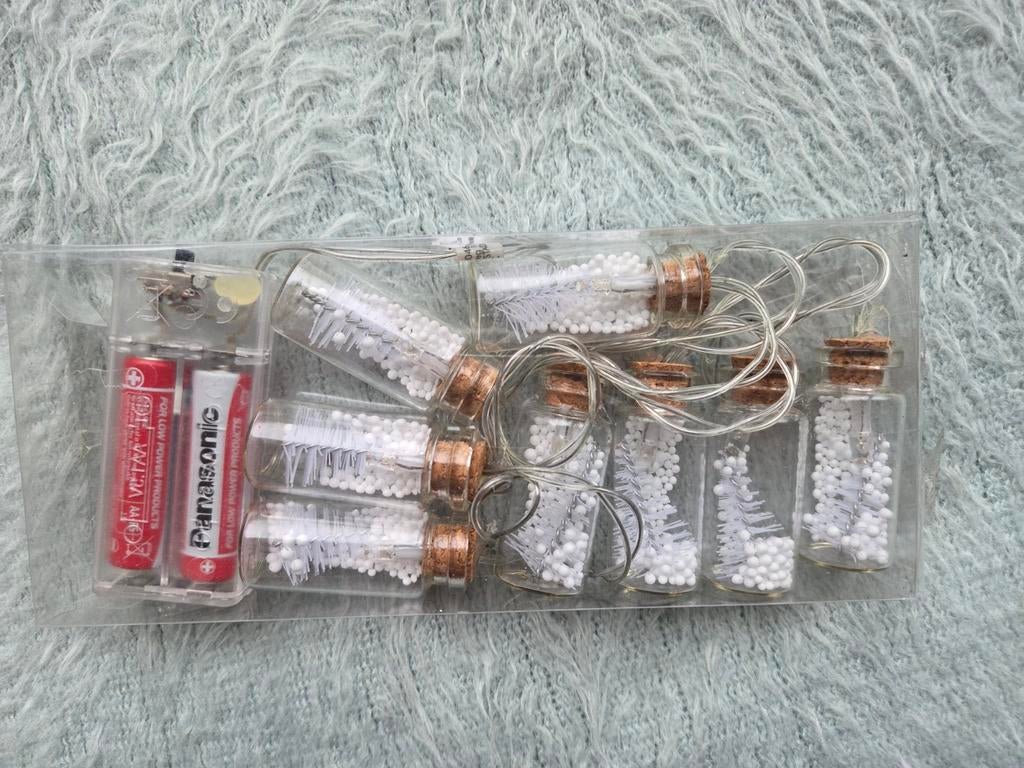 Kerst slinger lampjes in flesje, Ophalen