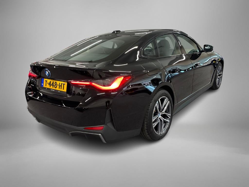 BMW i4 eDrive40 84 kWh GERESERVEERD (bj 2023, automaat), Achterwielaandrijving, Gebruikt, Leder en Stof, Origineel Nederlands