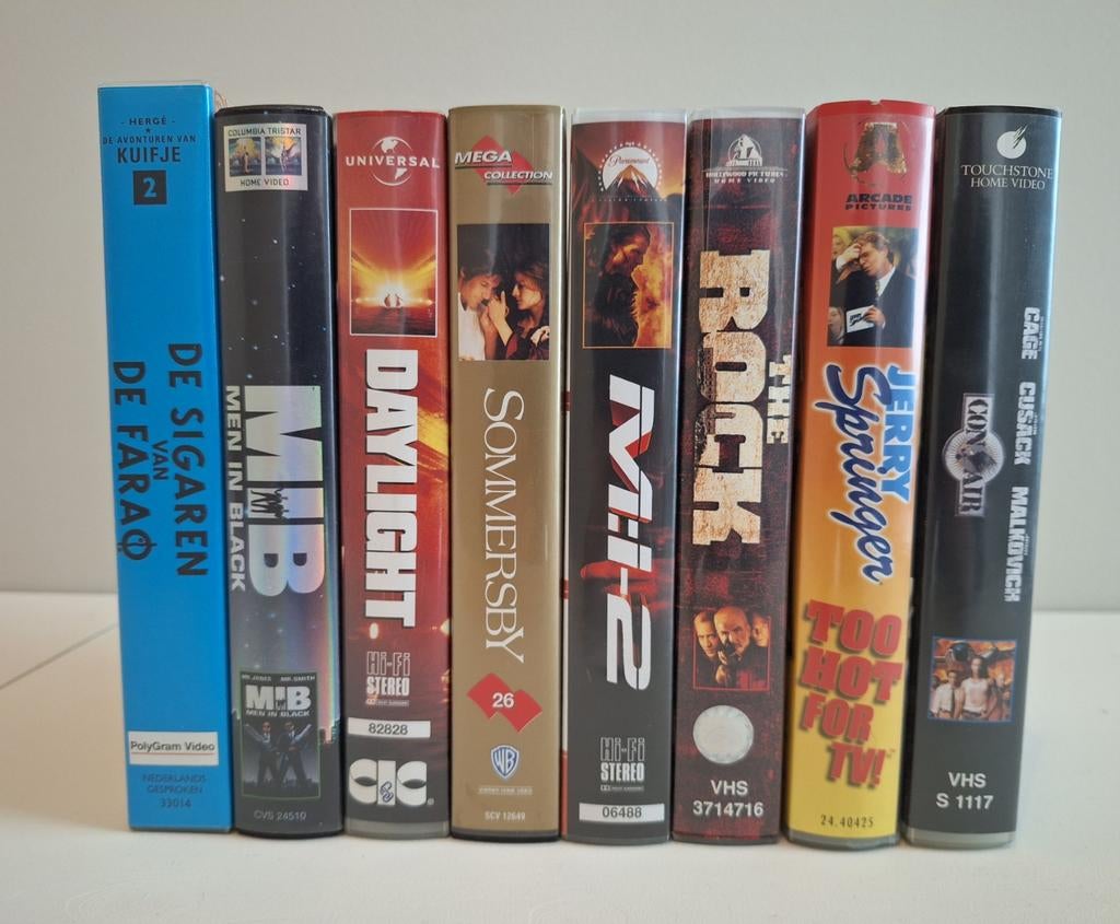 Set van 8 VHS banden: MIB, The Rock, Kuifje, Con Air e.a., Cd's en Dvd's, VHS | Film, Gebruikt, Alle leeftijden, Ophalen