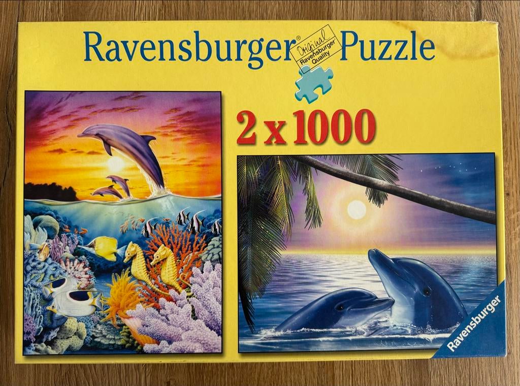 Ravensburger puzzel 2x1000 stukjes - Dolfijnen thema, Ophalen of Verzenden, 500 t/m 1500 stukjes, Zo goed als nieuw, Legpuzzel