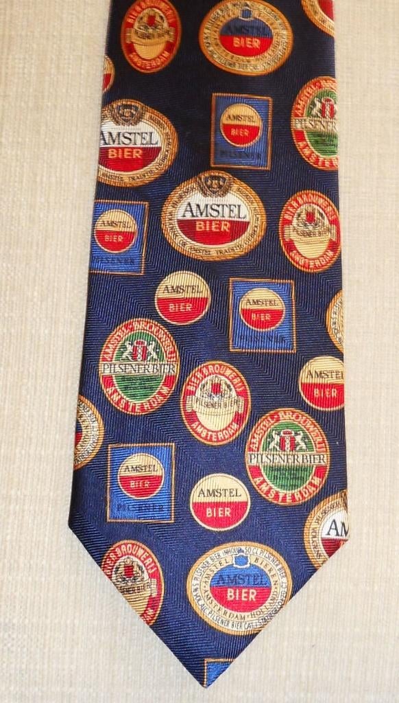 Amstel Bier stropdas met allemaal retro logo's, Ophalen of Verzenden, Nieuw, Overige kleuren