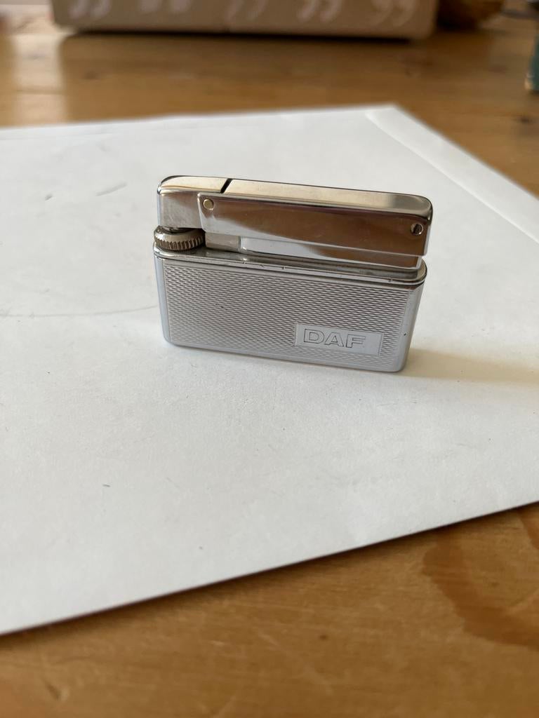 Zilverkleurige aansteker Rowenta met DAF logo, Ophalen of Verzenden, Gebruikt, Aansteker