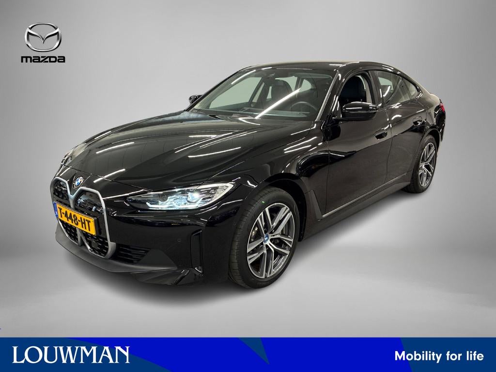 BMW i4 eDrive40 84 kWh GERESERVEERD (bj 2023, automaat), Achterwielaandrijving, Gebruikt, Leder en Stof, Origineel Nederlands