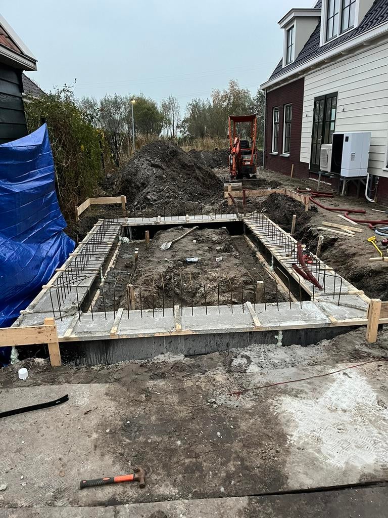 Stalen buispalen heipalen fundering beton grondafvoer  Heien