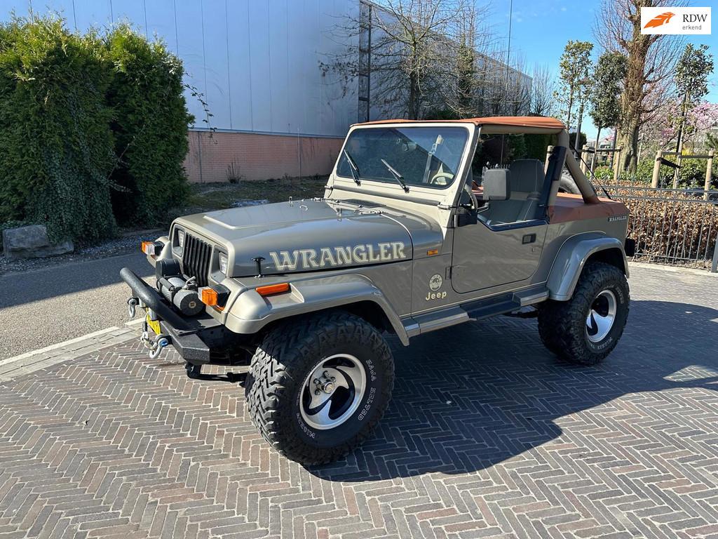 Jeep Wrangler 4.0i Sahara 6 cilinder YJ Cabrio met softtop, Auto's, Jeep, 657 kg, Stof, Gebruikt