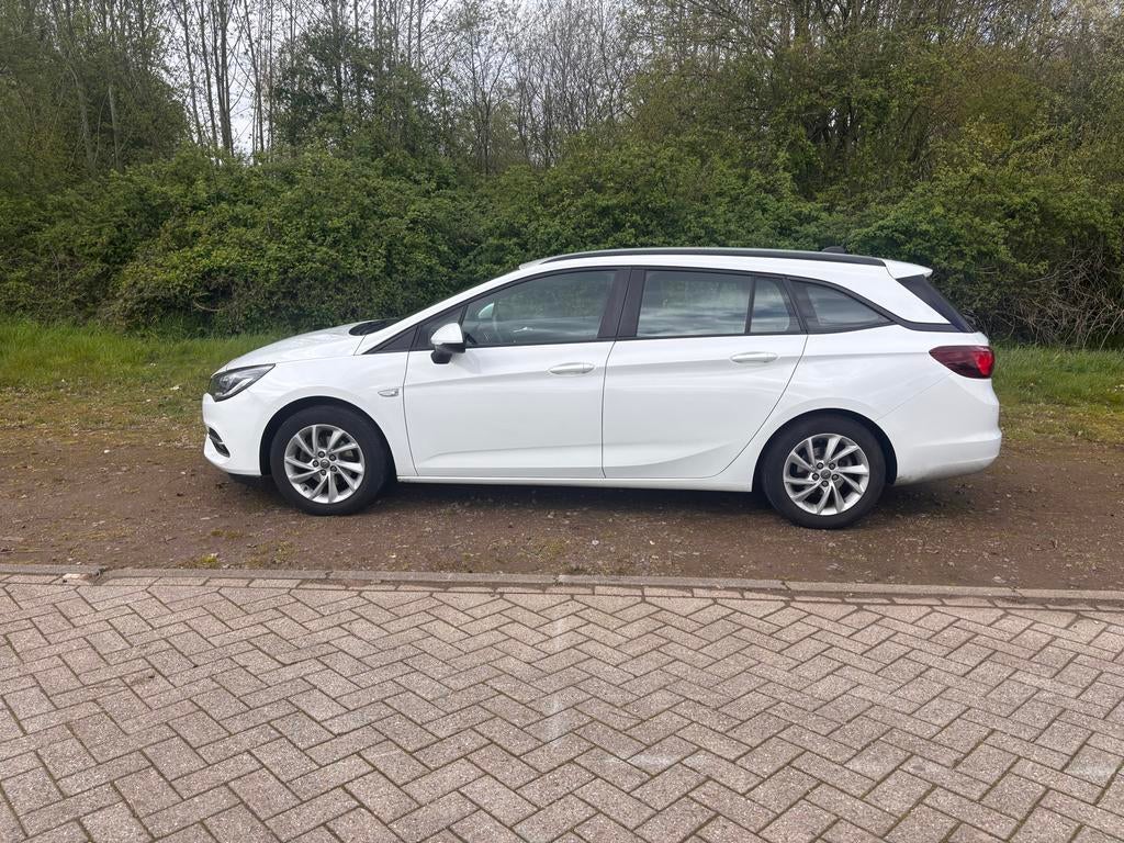 Opel Astra 1.2 Turbo 110pk Start/stop 2019 Wit, Auto's, Voorwielaandrijving, Stof, Zwart, 1199 cc