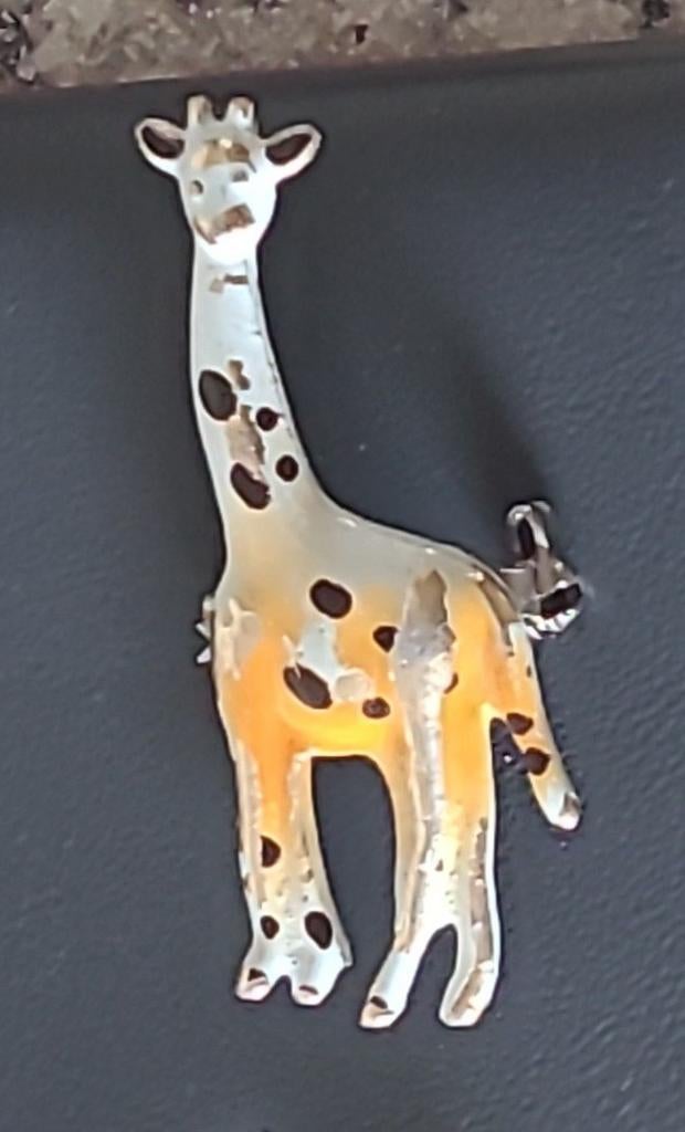 Broche in de vorm van een giraffe, Verzenden