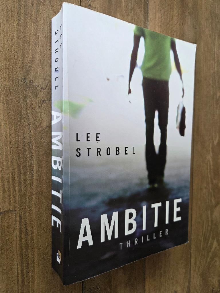 Ambitie - Lee Strobel (christelijke thriller), Boeken, Ophalen of Verzenden, Zo goed als nieuw