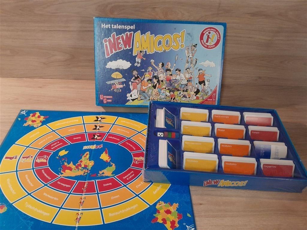 New Amigos - Het talenspel - Engels - Nederlands - s5861, Hobby en Vrije tijd, Gezelschapsspellen | Bordspellen, Verzenden, Zo goed als nieuw