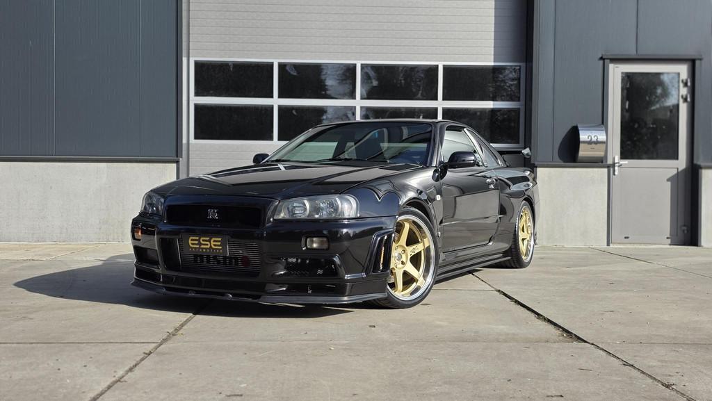 Nissan Skyline R34 GTR V-spec LHD (UK-Spec) 1 of 80, Auto's, Stof, Zwart, 2568 cc, Zwart