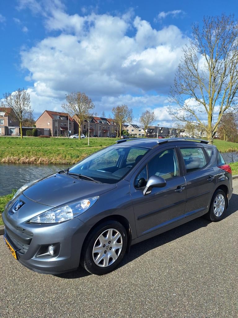 Peugeot 207 1.4 95pk 2010 Grijs, Auto's, Voorwielaandrijving, Stof, Zwart, Origineel Nederlands