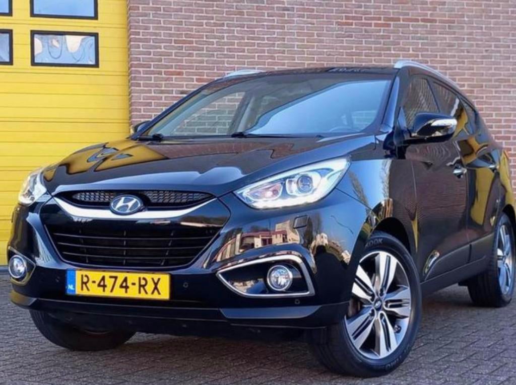 Hyundai ix35 2.0/ 4 seizoen banden/ automaat/ full option, Auto's, Automaat, Zwart, Zwart, Leder