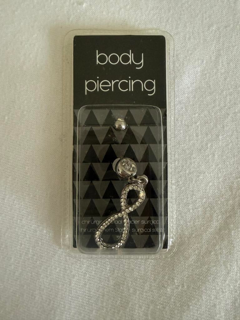 Navelpiercing met oneindigheidsteken en strass, Sieraden, Tassen en Uiterlijk, Piercings, Navelpiercing, Staal, Nieuw, Ophalen of Verzenden