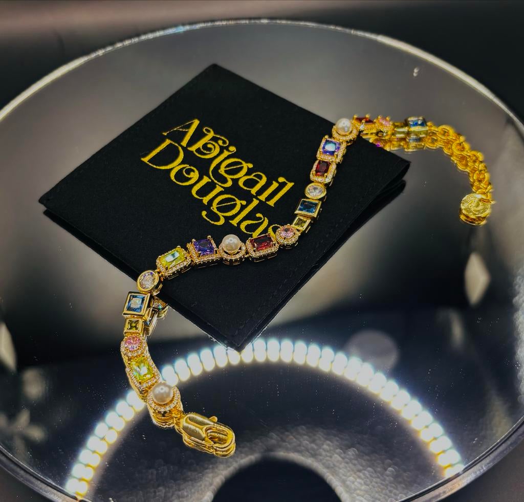 Gouden en zilveren armband met gekleurde stenen, Ophalen of Verzenden, Gebruikt, Goud, Met edelsteen