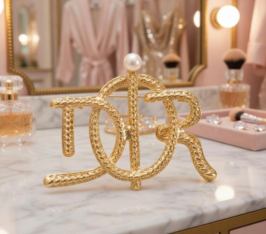 Gouden broche met parel D I O R, Overige materialen, Nieuw, Ophalen of Verzenden, Met parel