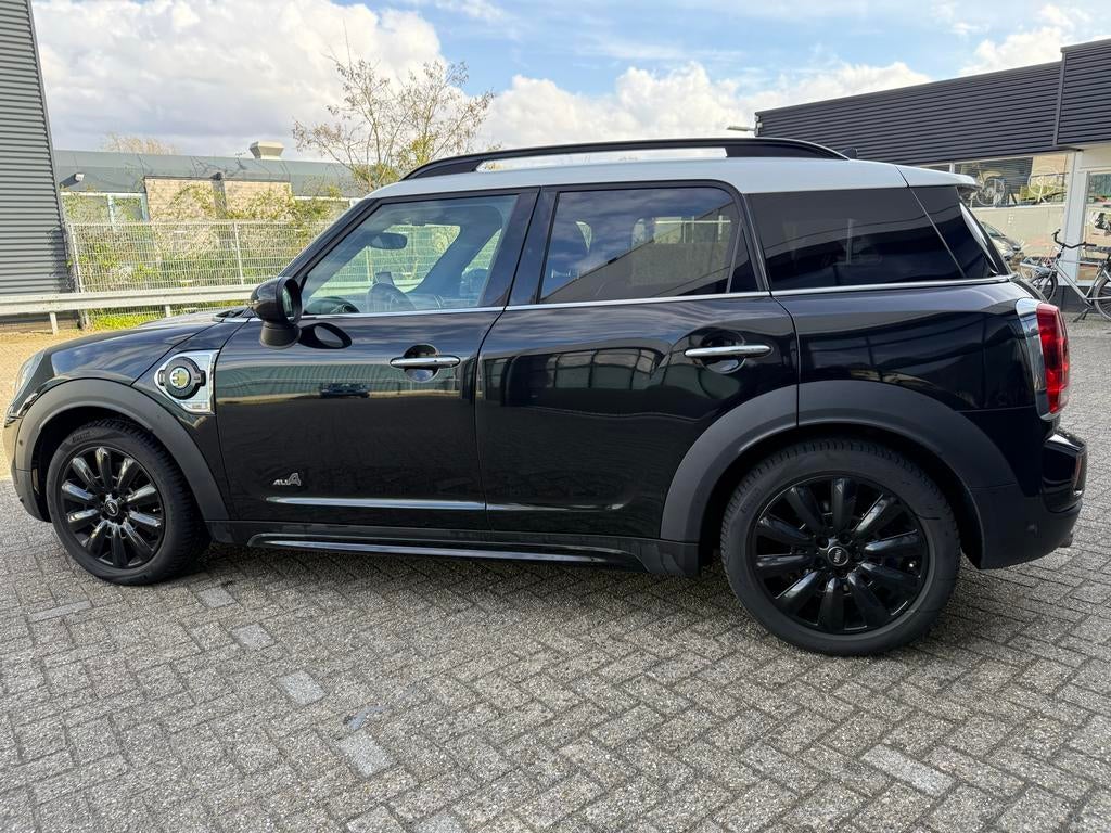 Mini Countryman Cooper SE All4 automaat zwart, Auto's, Mini, 136 pk, Zwart, Countryman, Zwart