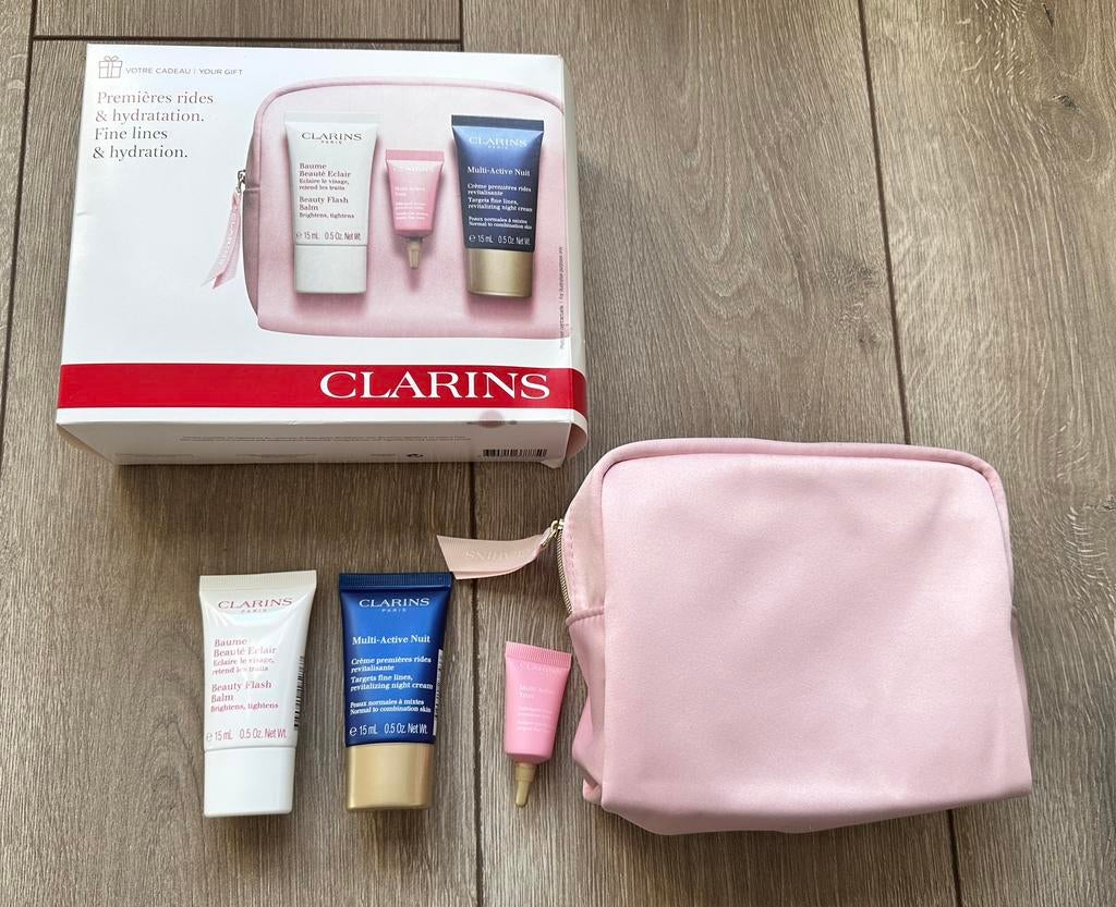 Nieuw: Leuk Make Up tasje van Clarins met luxe miniaturen, Ophalen of Verzenden, Nieuw, Gehele gezicht, Verzorging