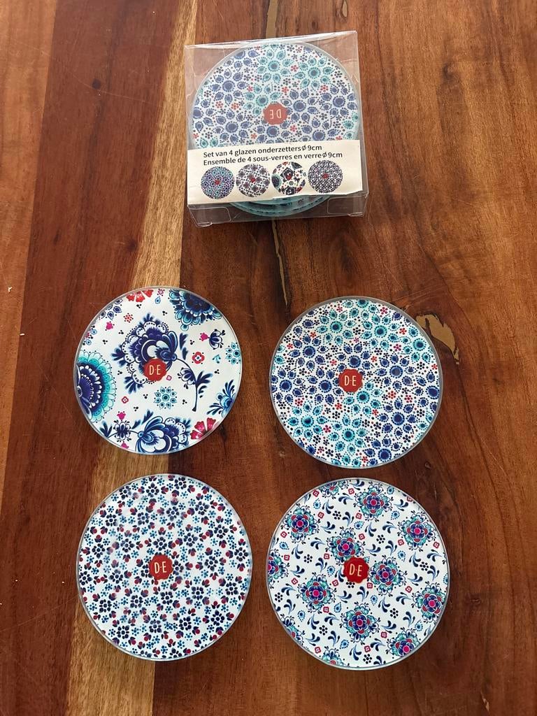 Set van 8 glazen  ronde  onderzetters douwe egberts, Ophalen of Verzenden, Nieuw, Glas of Kopje