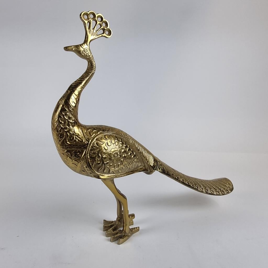 &Klevering Pauw goudkleurig, Ophalen