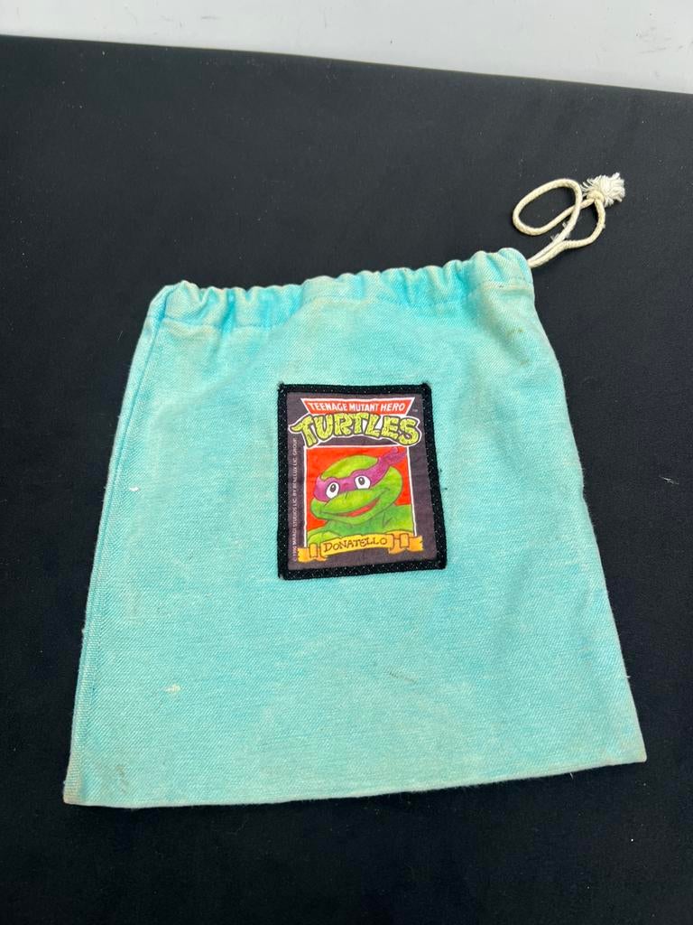 Te Koop : Vintage Knikkerzak Ninja Turtles Donatello Knikker, Antiek en Kunst, Antiek | Speelgoed, Ophalen of Verzenden