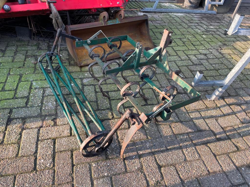 Cultivator met rol voor grondbewerking, Ophalen