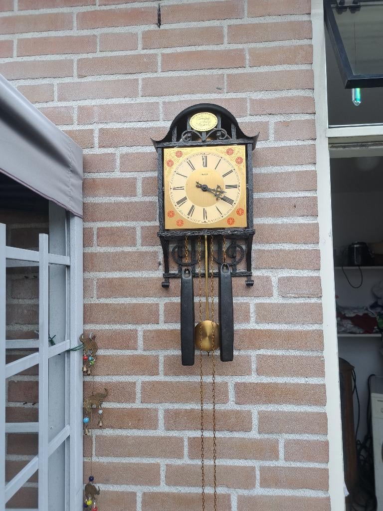 antieke wandklok, Ophalen