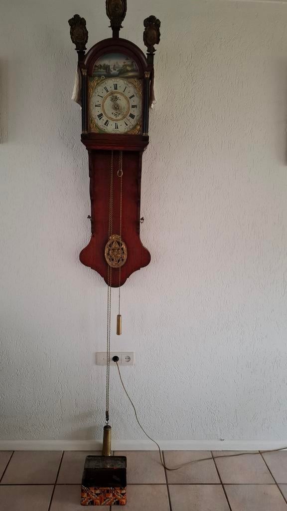 Antieke Friese staartklok, Ophalen