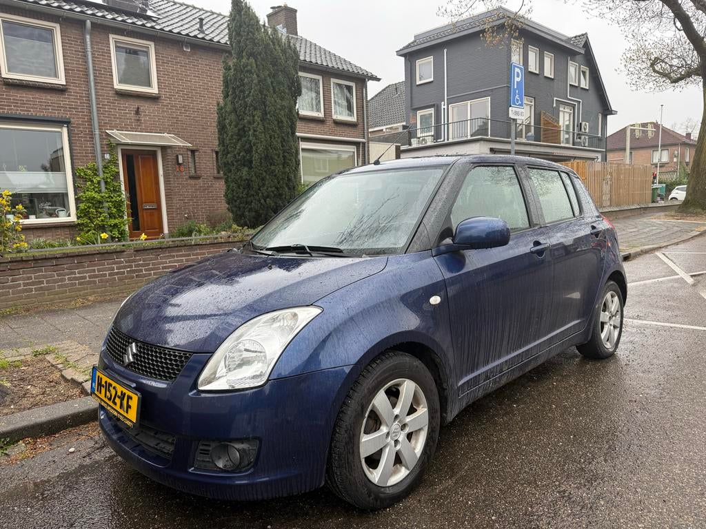Suzuki Swift 1.3 5Drs 2010 | stoelverwarming, Stof, 40 €/maand, Zwart, Swift