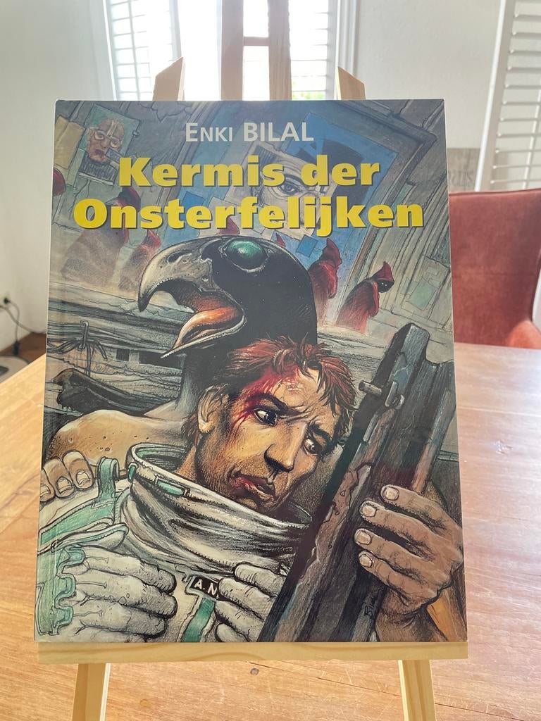 Kermis der Onsterfelijken - Enki Bilal stripboek, Boeken, Stripboeken, Zo goed als nieuw, Eén stripboek, Ophalen of Verzenden