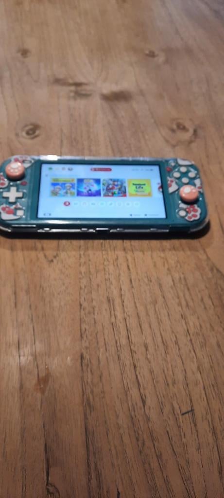 Nintendo Switch Lite Turquoise + accessoires, z.g.a.n., Ophalen of Verzenden, Turquoise, Gebruikt, Met beschermhoes of tas