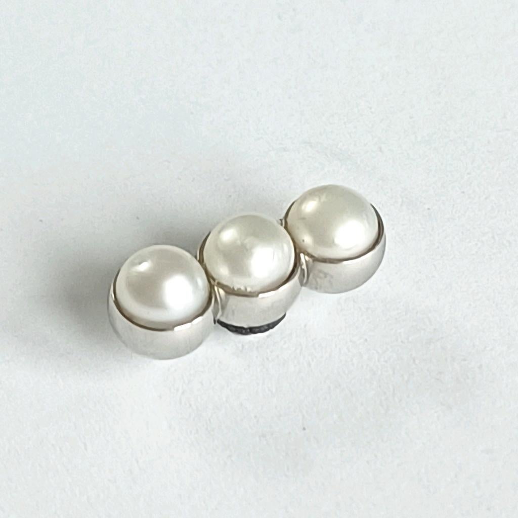 Zilverkleurige Melano twisted trio pearl, Verzenden