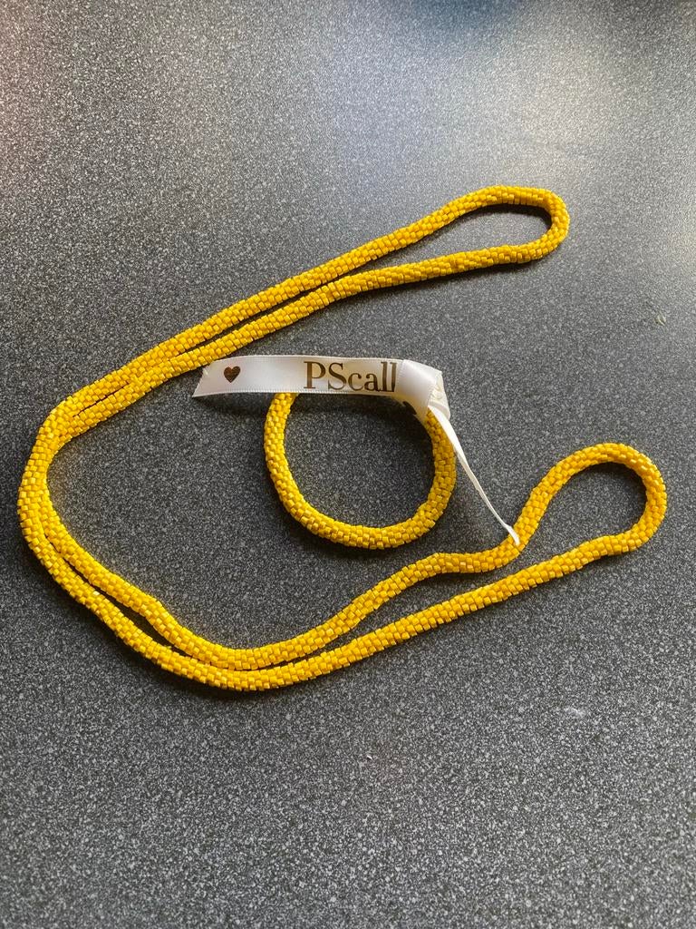 Kraaltjes armband en ketting van PScallme, Overige materialen, Gebruikt, Geel, Ophalen of Verzenden