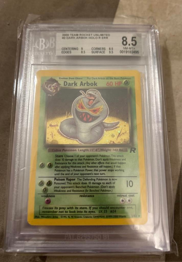 Team Rocket Dark Arbok Error - Beckett 8.5, Ophalen of Verzenden, Zo goed als nieuw, Losse kaart