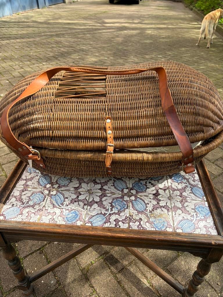 Antieke draagmand voor baby, Ophalen