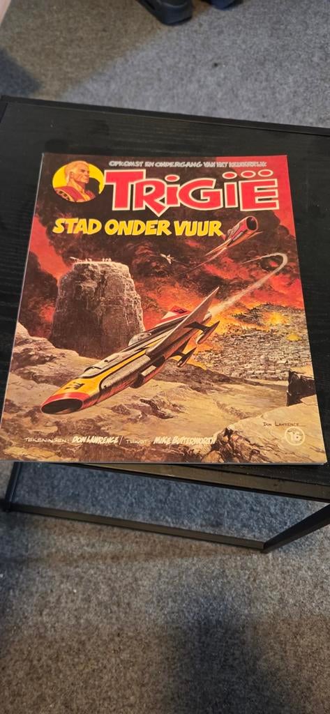 Trigie: Stad onder Vuur stripboek, Eén stripboek, Ophalen of Verzenden, Gelezen