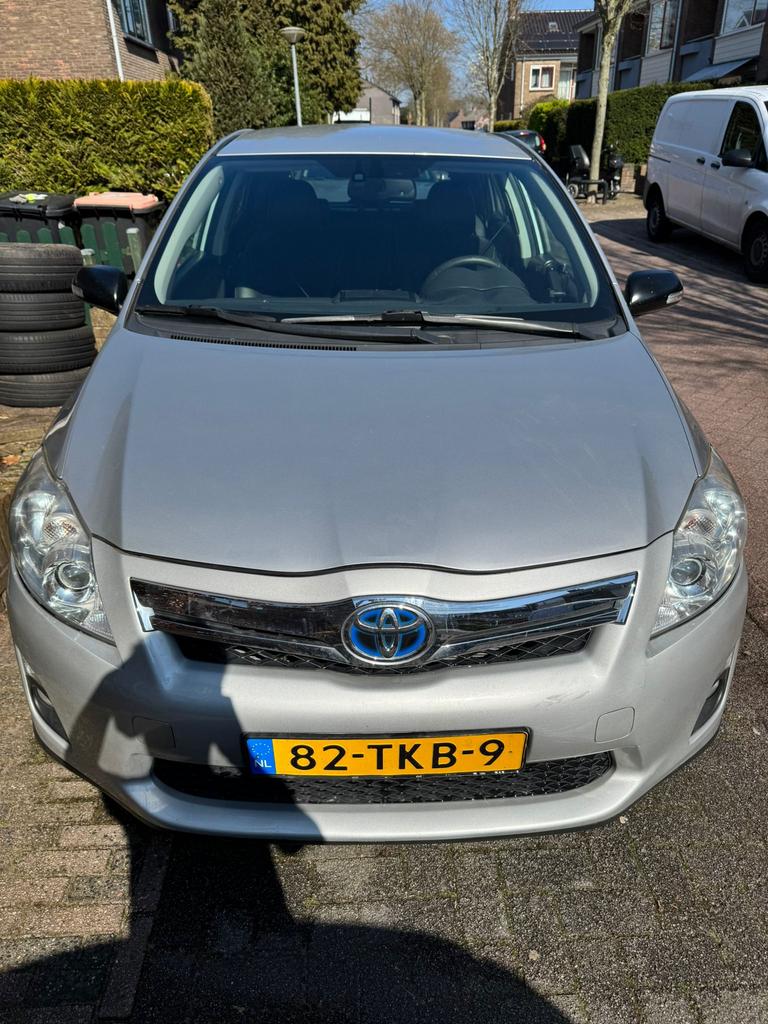 Toyota Auris 1.8 Full Hybrid 136PK 5D CVT 2012 Grijs, Auto's, Dealer onderhouden, 25 km/l, Auris, Te koop