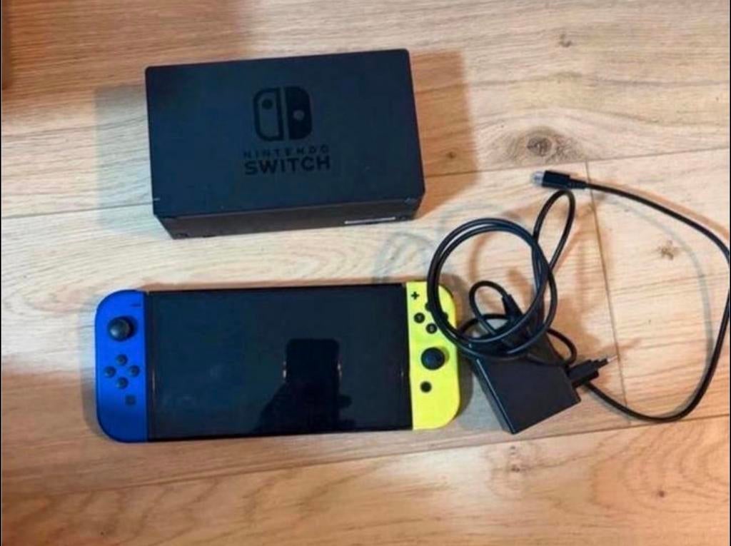 Nintendo Switch oled met blauwe en gele Joy-Cons, Sn, Gebruikt, Overige genres, 1 speler