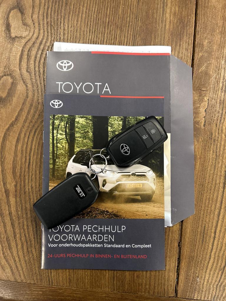 Toyota Yaris 1.5 Hybrid 115 Business Automaat | Panoramadak, Gebruikt, Met garantie (alle), 450 kg, Wit