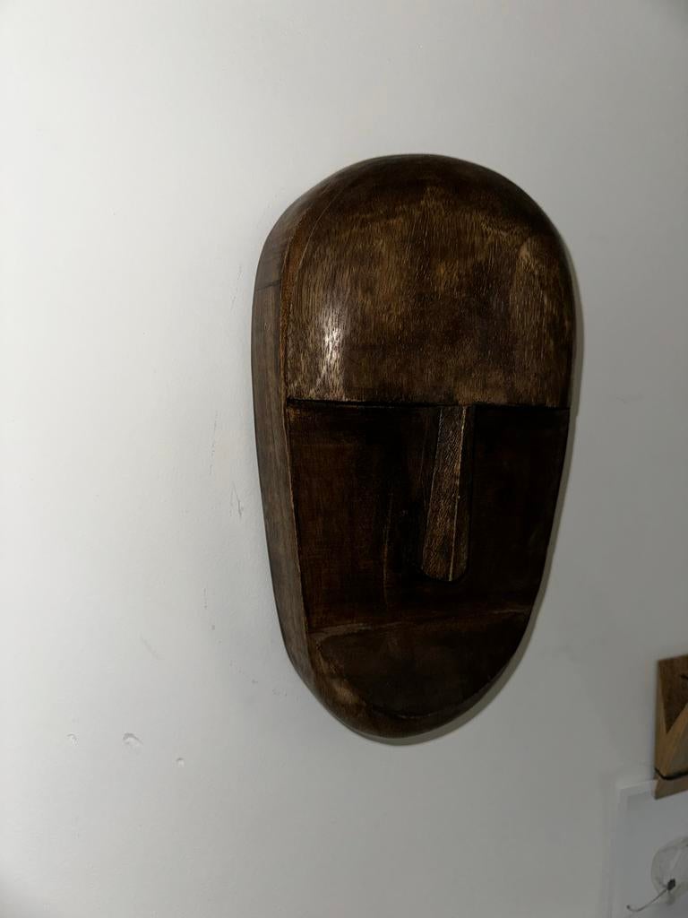 Houten hoofd wanddecoratie, Ophalen