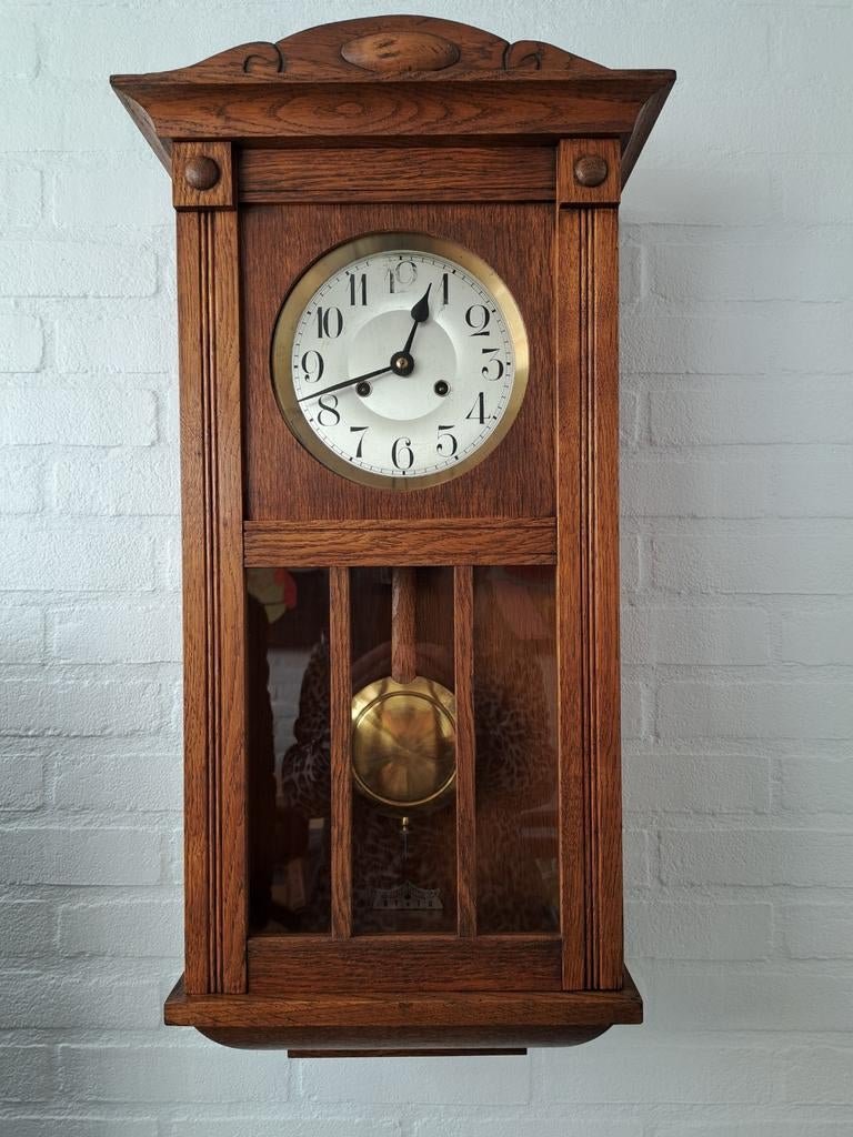 Houten bim bam wandklok met slinger, Ophalen