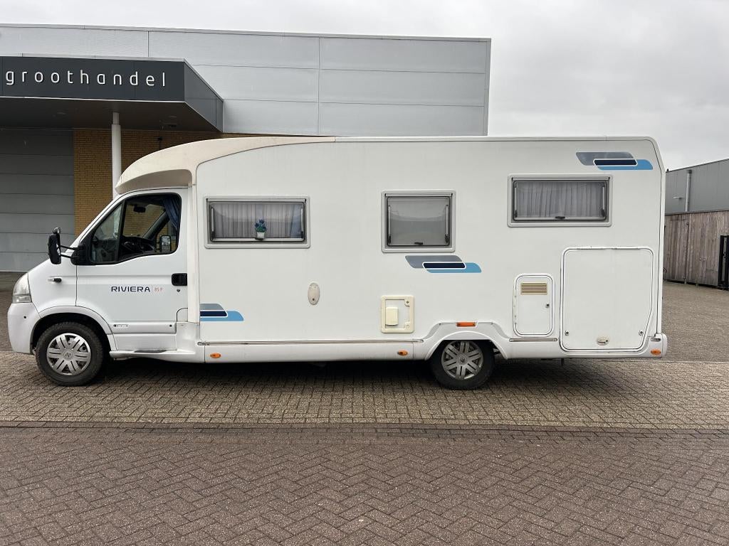 Camper Renault CI Garage Riviera P 85 - AUTOMAAT, Caravans en Kamperen, Campers, Automaat, Standaard zit, 7 tot 12 maanden geleden