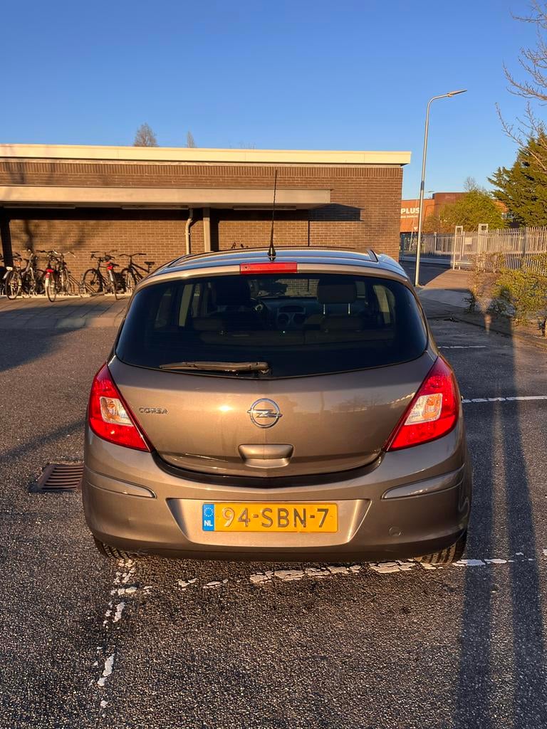 Opel Corsa 1.2 16V 5D 2011 Grijs, Voorwielaandrijving, 4 cilinders, 1229 cc, 49 €/maand