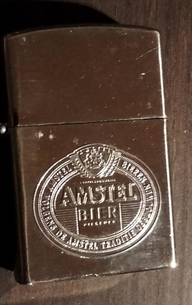 Zippo Amstel bier-ongebruikt, Ophalen of Verzenden, Nieuw, Aansteker