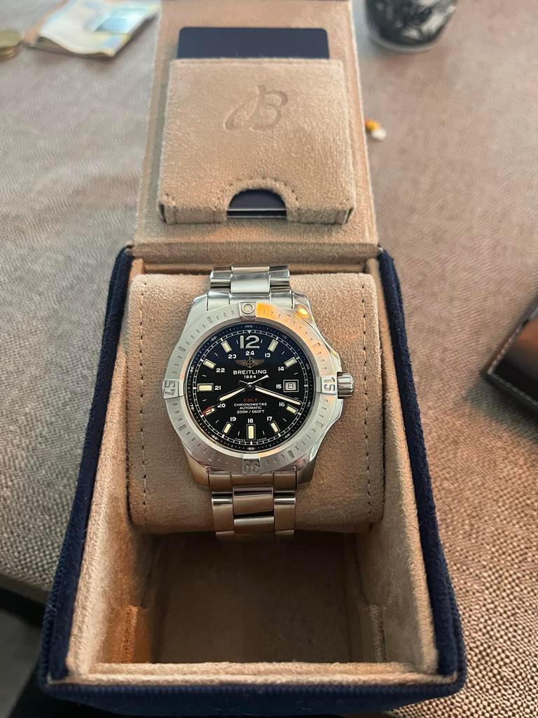 Breitling in Nieuwstaat - Compleet met doos en papieren, Sieraden, Tassen en Uiterlijk, Horloges | Heren, Ophalen, Staal, Breitling