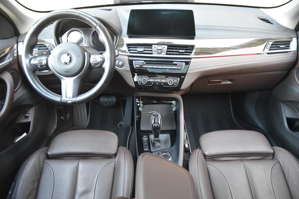 BMW X1 sDrive20i VDL Nedcar Edition * Sportstoelen * Panoram, 1998 cc, Met garantie (alle), Zwart, Leder